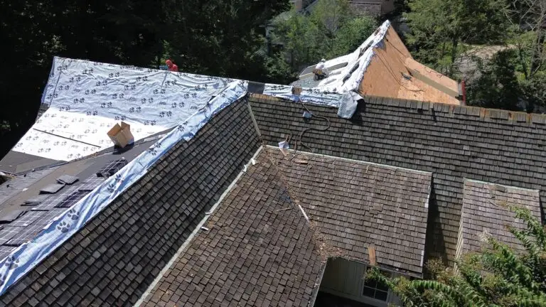 Roof under construction with workers on top