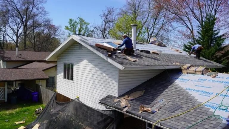 Installation of shingles by TopLine Roofing.