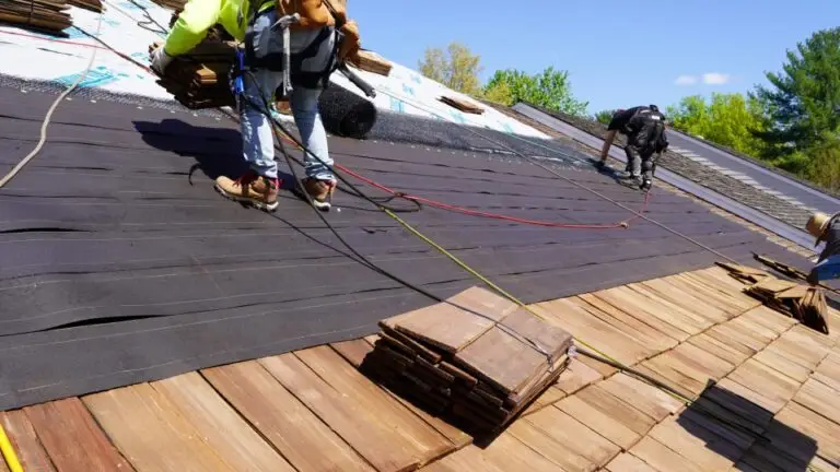 Pressure treated cedar shake installation by TopLine Roofing.