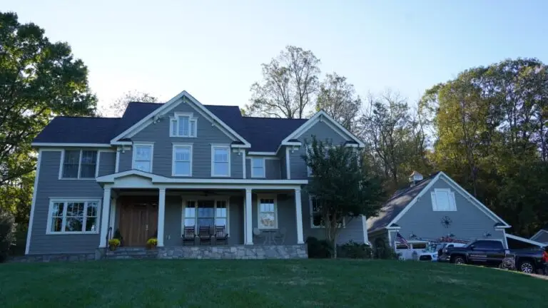 Modern suburban house with front porch and garage.